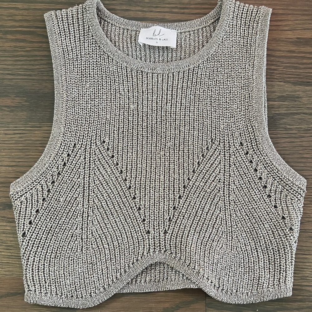 Brand new silver shiny crop top from the boutique Bobbles and Lace in size small